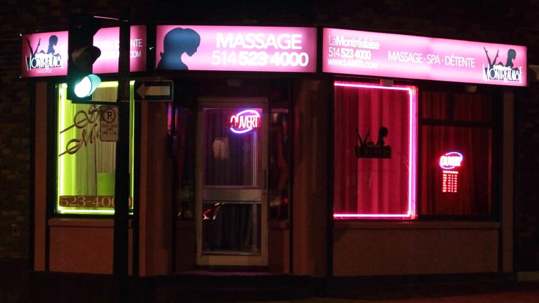 La Montrealaise storefront with neon signage at night in Montreal